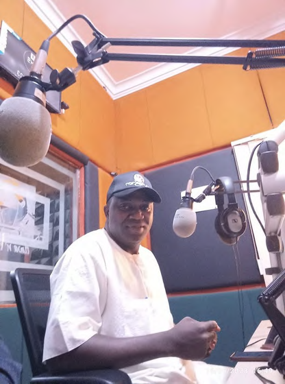 MOK Foundation team member at a radio outreach